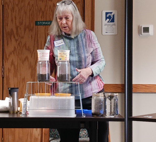 Jean Eells demonstrates a slake soil test during a Learning Circle Presentation